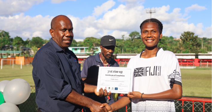 PVFA‘s Vice President John Stephen Tougon with ‘yut rise up’ PVFA graduate Jessica James. Credit: yutriseup/Savvy Vanuatu